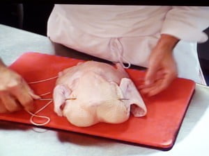 Thread needle thru the breast and into opposite wing - FG