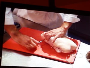 Pass needle through tailpiece then tie off around legs - FG