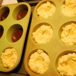 Fill muffin cups to 1/3, create well in batter.