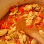 Season, add tomatoes and garlic.