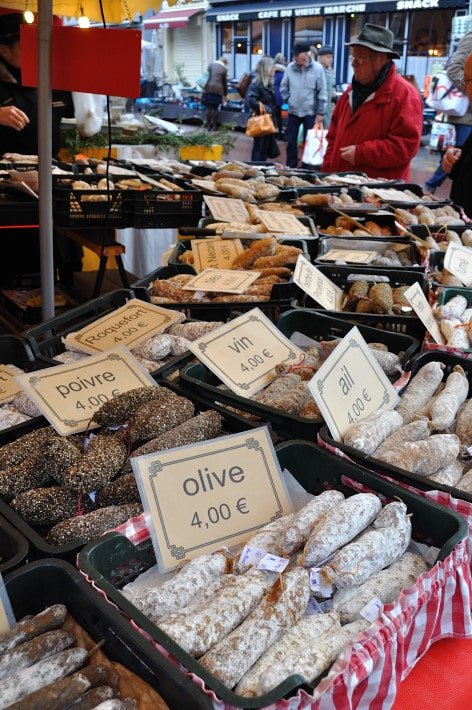 Charcuterie stall, outdoors.  Dijon Market - Food Gypsy