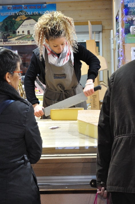 Cutting wheels of cheese, Les Halles - Food Gypsy