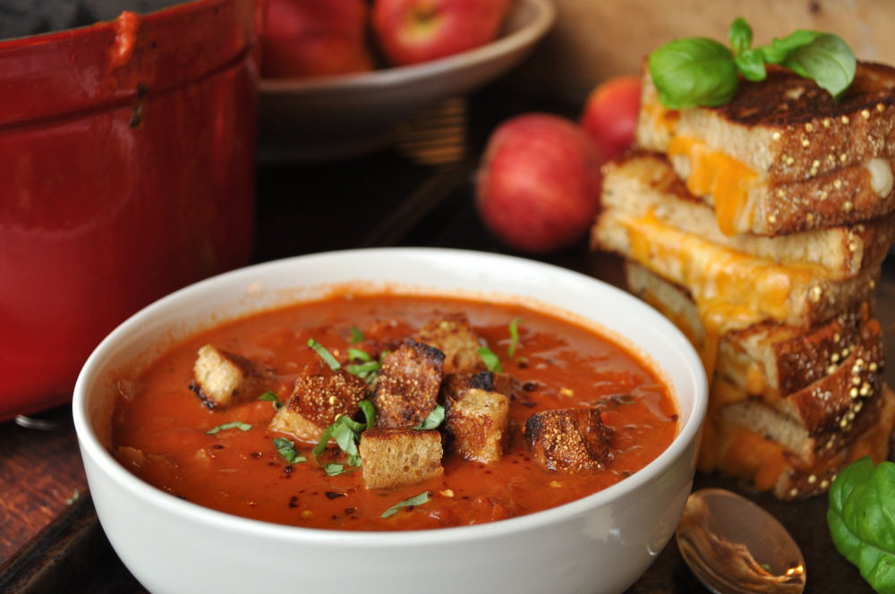 Rustic Creamy Tomato Soup with toasted croutons, chilies & basil.